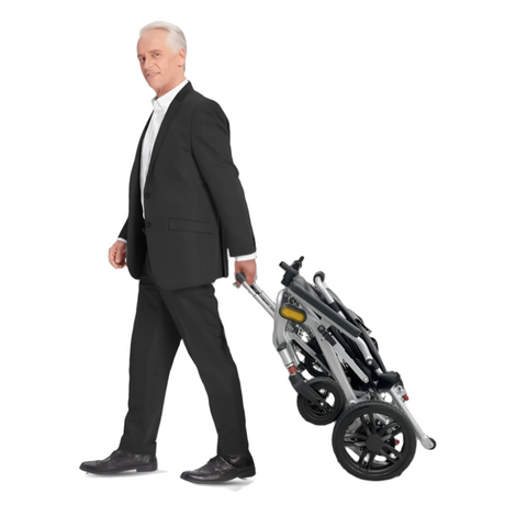 man pulling the eezy traveller electrical wheel chair