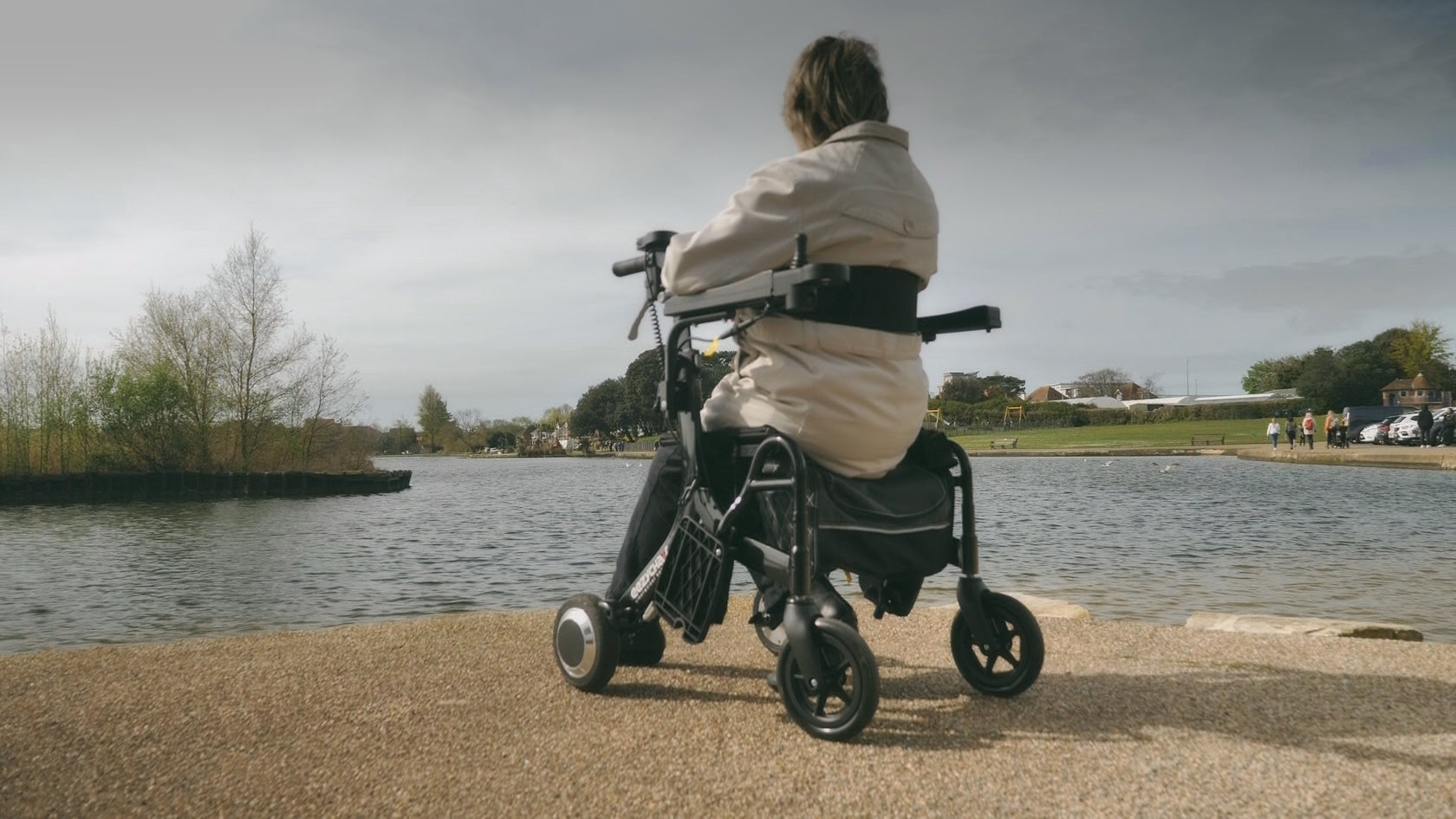women sitting on the eezy roller wheelchair, looking over a river