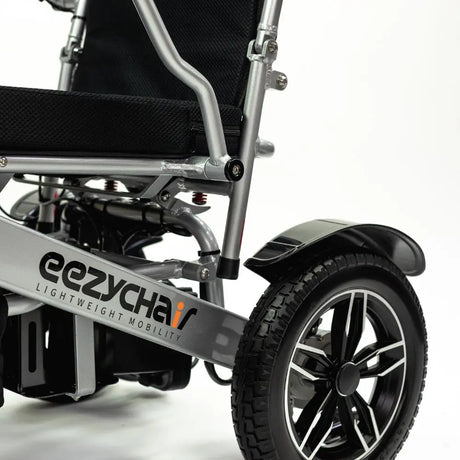 Side view of a refurbished mobility scooter, focusing on the wheel and lower body