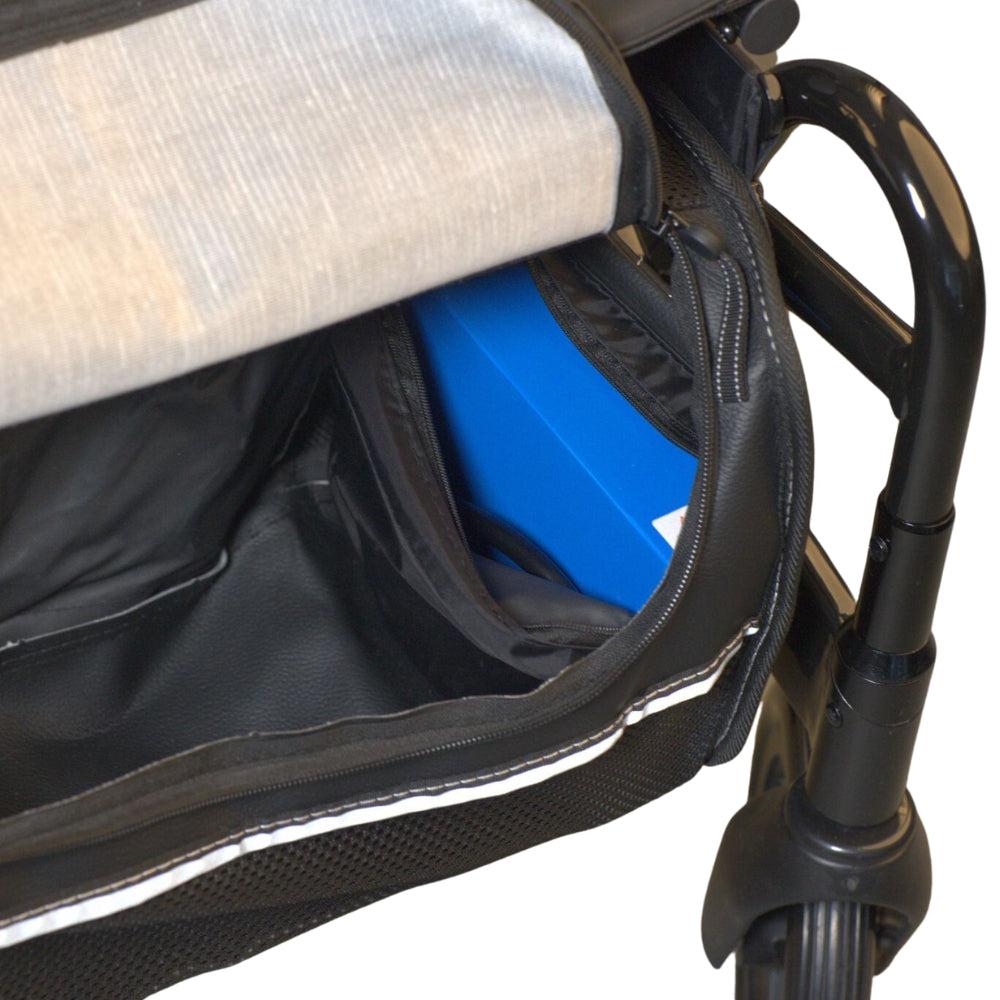blue coloured battery inside electric rollator bag near foot rest