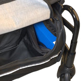 blue coloured battery inside electric rollator bag near foot rest
